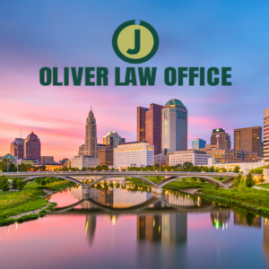 Columbus skyline at sunset reflected in river, arched bridge in foreground, Oliver Law Office logo overlay