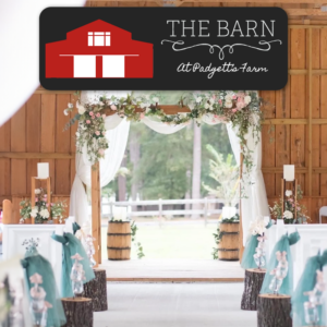 Rustic barn wedding aisle with floral arch and teal decor, The Barn at Padgett's Farm logo overlay