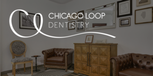 Chicago Loop Dentistry waiting room with brown leather chairs, framed wall art, wood cabinet, and logo overlay