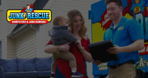 Mother holding baby reviews rental details with staff member; Jumptastic Party Rentals logo on home backdrop