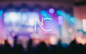 Blurred concert-style stage with vibrant blue and purple lights, featuring the 'NC New Covenant' logo centered